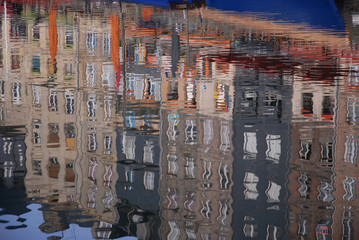 buildings reflected in calm water of the Vieux Bassin, in the picturesque town of Honfleur, Calvados, Normandy, France