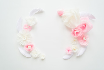 white and pink paper flowers on the white background