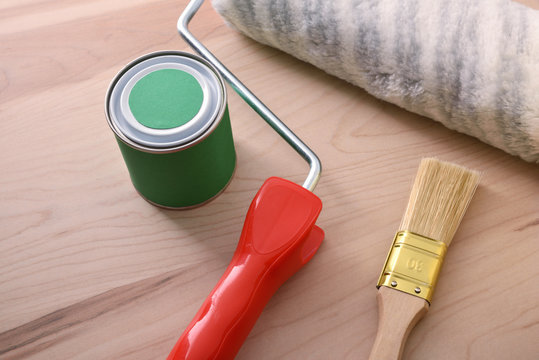 Tools for painting of houses on wood table elevated view