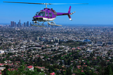 helicopter flying over the city - obrazy, fototapety, plakaty