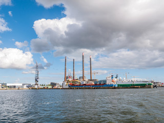 Ships docked in shipyard near NDSM wharf on northern bank of IJ river in Amsterdam, Netherlands