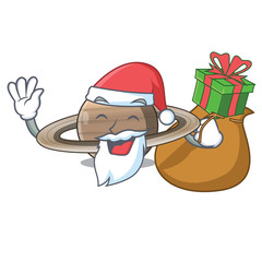 Santa with gift planet saturn above the sky cartoon © kongvector