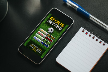 Sports betting app in a mobile phone screen. - 243466951