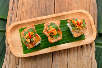 Garlic pork on wooden background