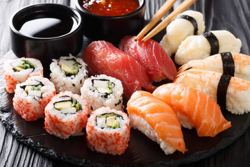 Variety of sushi food. nigiri, maki, uramaki and roll with tuna, salmon and shrimp. Asian food with raw fish and rice. horizontal