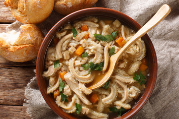 Polish homemade meal stew flaczki with vegetables close-up in a bowl. horizontal top view