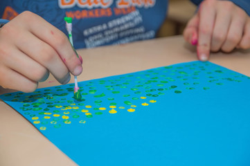 education, school, art and painting concept - showing painted hands