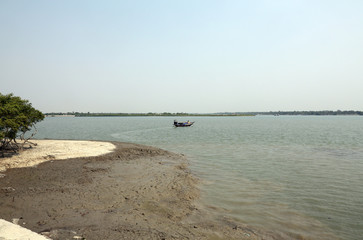 Traditional fishing boat in the delta of the Ganges River in Sundarbans Jungle National Park in India