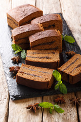 Traditional Polish dessert Piernik in plum jam closeup. vertical