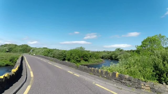 Driving across the stone bridge over the caragh river.