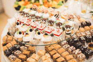 Different kinds of baked sweets on a buffet