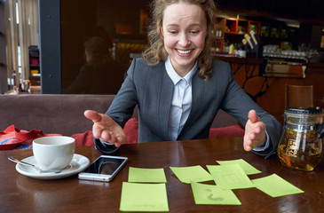 Fototapeta premium thinking joyful woman found a solution. Many stickers, questions, options. Concept portrait. eureka, success, discovery
