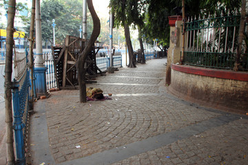 Fototapeta na wymiar Homeless people sleeping on the footpath of Kolkata, India.