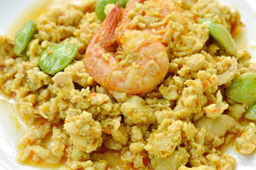spicy stir fried twisted cluster bean with shrimp and chop chicken on dish