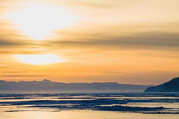 The Baikal lake in winter during sunset