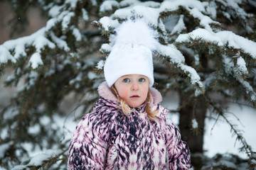 little girl on walk in winter park,