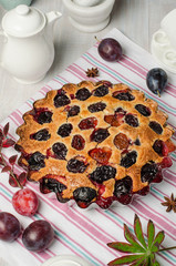 Plum pie on a light background.