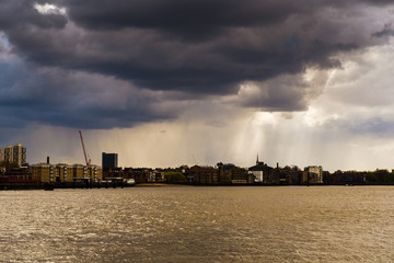Fototapeta na wymiar Dark clouds over London's financial district