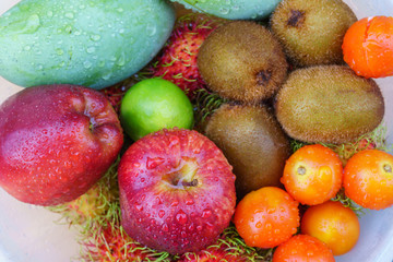 Obraz na płótnie Canvas Mixed of tropical fruits close up, healthy concept.