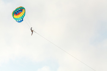 parasailing in the bay of the Kata beach of Phuket island of Thailand