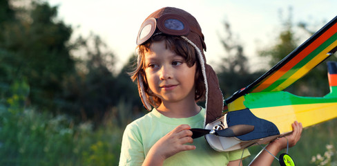boy with homemade radio-controlled model aircraft