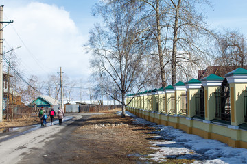a family is going along the street