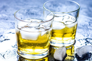 glass of whiskey on dark background
