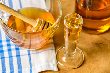 homemade mead (honey wine) on an old table close up