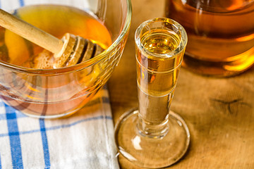 homemade mead (honey wine) on an old table close up