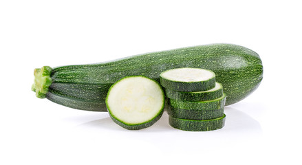 green zucchini with slice isolated on white background