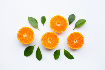 Orange fruits with  leaves on white background.