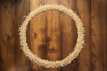 wheat grains on wooden background