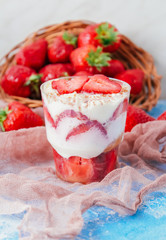 Strawberries with cream or tiramisu in small glasses 