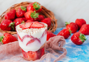 Strawberries with cream or tiramisu in small glasses 