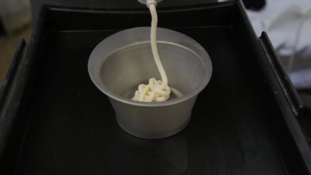 process of mixing of components for reception without an aldehyde paint in a beauty salon. slow motion