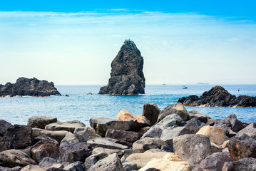 Acitrezza rocks of the Cyclops, sea stacks in Catania, Sicily, Italy