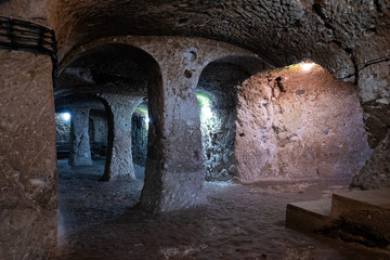 underground sncient stone tunnel gallery with columns