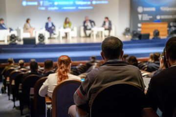 Audience listens to the lecturer at the conference