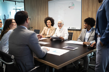 Group of successful business people at work in office