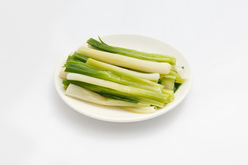 shallot white on plate fresh garden vegetables  white backgroud  