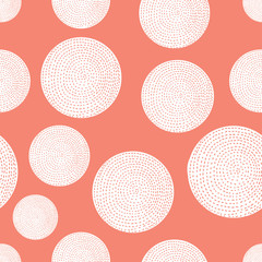 Decorative abstract polka dots in the style of the 60s. Coral color.
 Cheerful polka dot vector seamless pattern. Can be used in textile industry, paper, background, scrapbooking.