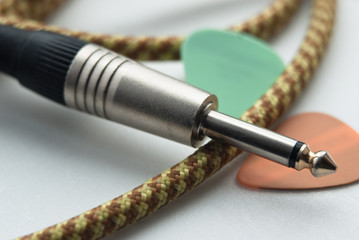 Naklejka premium guitar jack and picks. close up shot. music accessories