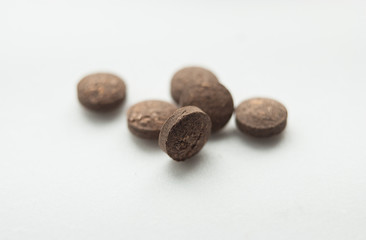 natural pills on white background. macro
