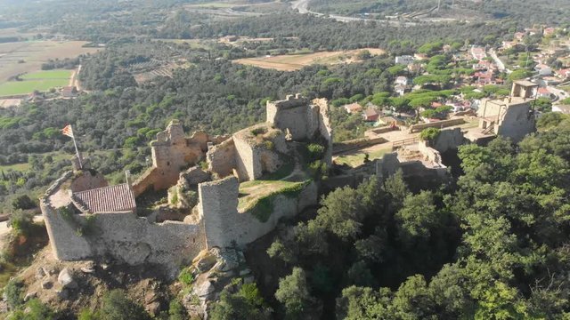 Beautiful landscape of the Palafolls Castle on a sunny day. Catalonia Spain. Aerial view travelling orbit