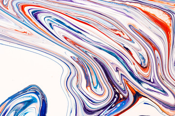 Mixture of acrylic paints. Blue, purple and coral red mixed acrylic paints. Liquid marble texture. Applicable for design packaging, labels, business cards, and interactive web backgrounds.