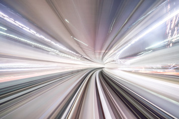 Motion blur of train moving inside tunnel with daylight in tokyo, Japan.