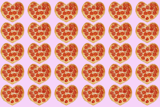 many pizza in shape of heart concept valentine's day isolated on pink. background for 14 february