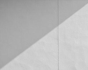 Abstract background of a white wall with shadows