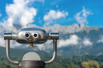 Coin operated binoculars on a mountain landscape