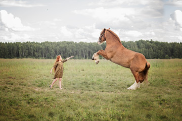 girl with horse in the field